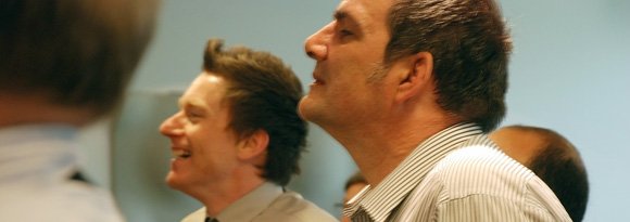Two men at Lasa's circuit rider conference looking towards the speaker